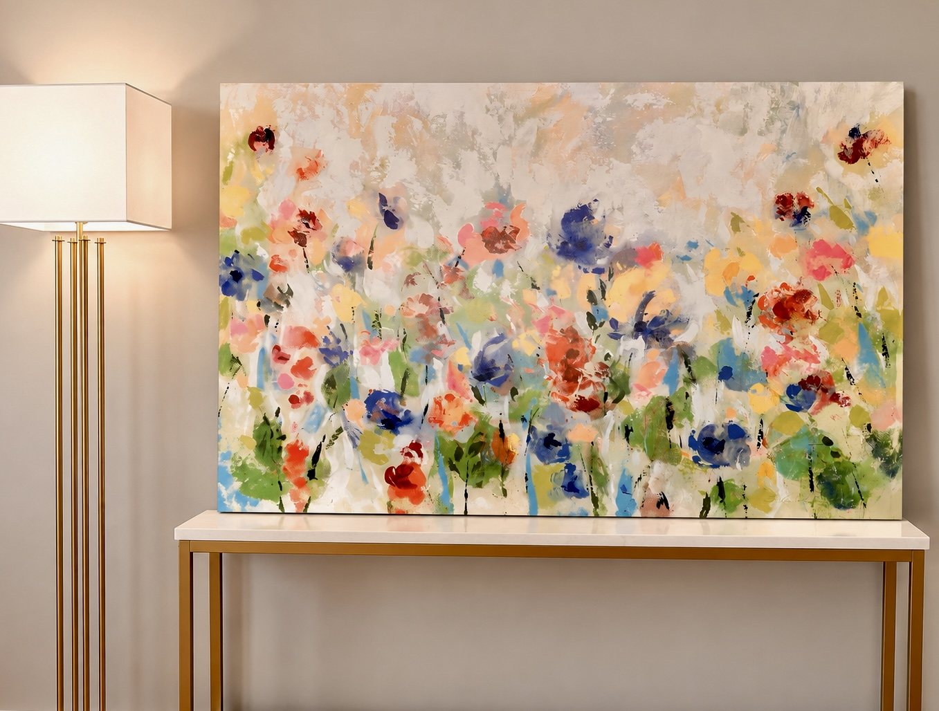 Colourful abstract floral artwork above console and lamp