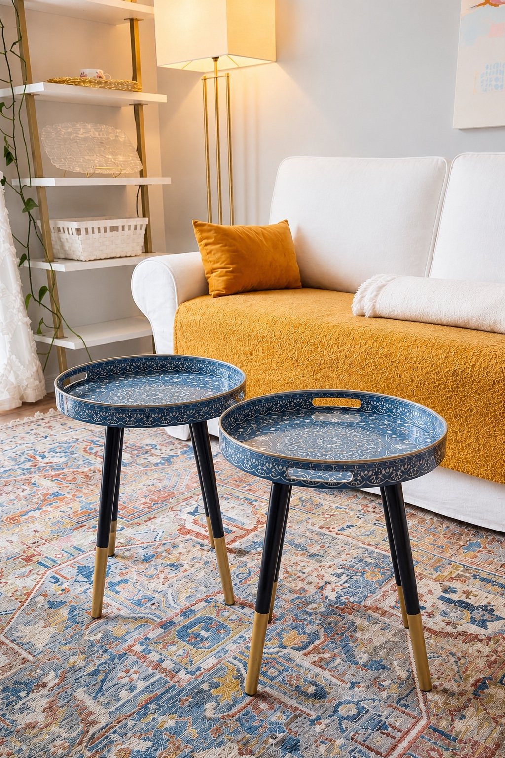 Blue tray tables staged in a living room with patterned rug and warm sofa accents